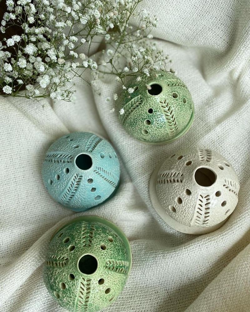 Pierced ceramic lanterns made at Mudcast Studio