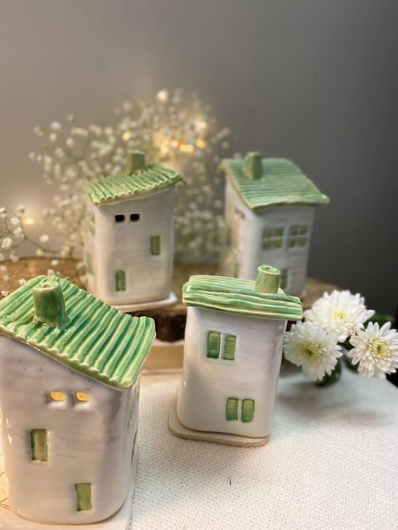 Handmade ceramic houses by Mudcast Pottery Studio